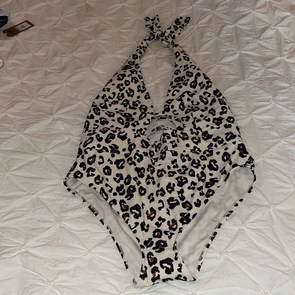 New, never worn, one piece swimsuit. Size XL, 12-14